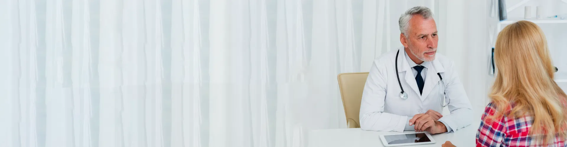 Professional Australian doctor providing telehealth consultation