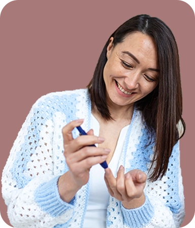 Person checking blood sugar levels as part of diabetes self-management and care.